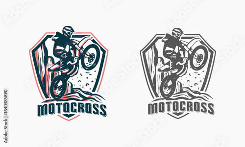 Motocross Rider Performing a Wheelie on a Dirt Bike