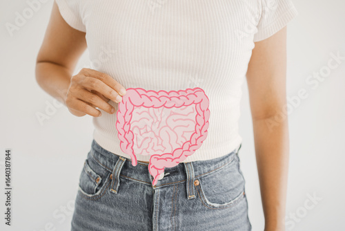 hands holding intestine shape, healthy bowel digestion, leaky gut, probiotic and prebiotic for gut health, colon, gastric, stomach cancer
