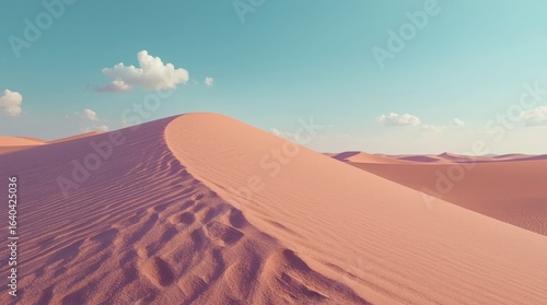 Fototapeta Naklejka Na Ścianę i Meble -  Desert Landscape with Pink Sand Dunes Under Blue Sky and Clouds – Scenic Photography of Arid Serenity in Nature for Travel and Vacation
