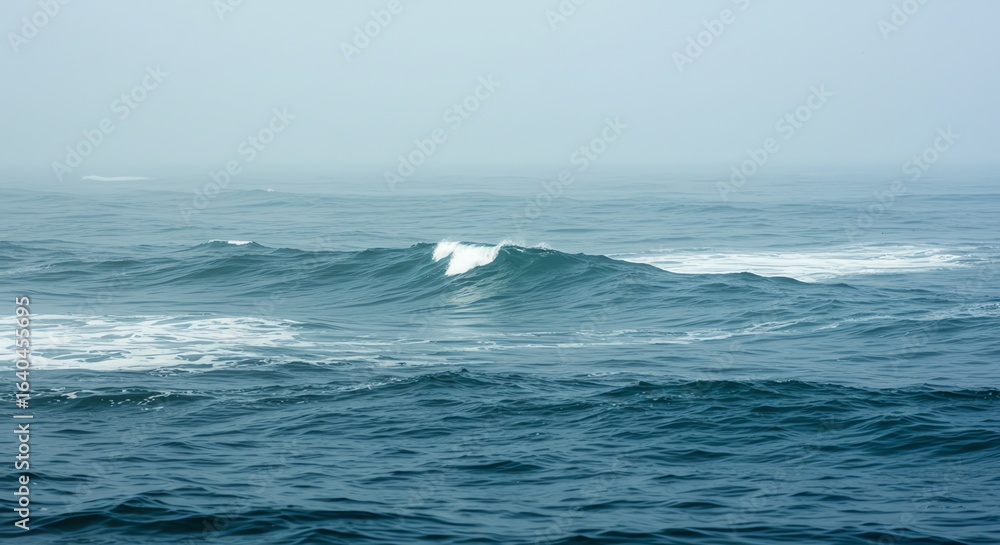 Calm Blue Ocean Waves Rolling Under Overcast Sky Calm Blue Ocean Waves Rolling Under Overcast Sky