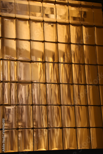 Golden Glass Block Wall with Light Reflection