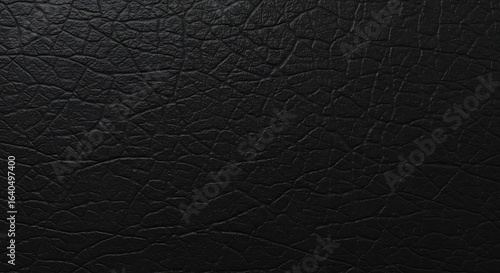 Elegant black leatherette material with a detailed creased texture for luxury design
