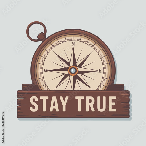 Vintage brass compass with a wooden sign that says stay true representing guidance direction and authenticity in life s journey