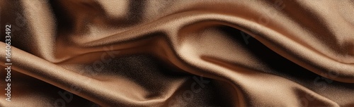 Close-up of luxurious, draped, light brown silk fabric