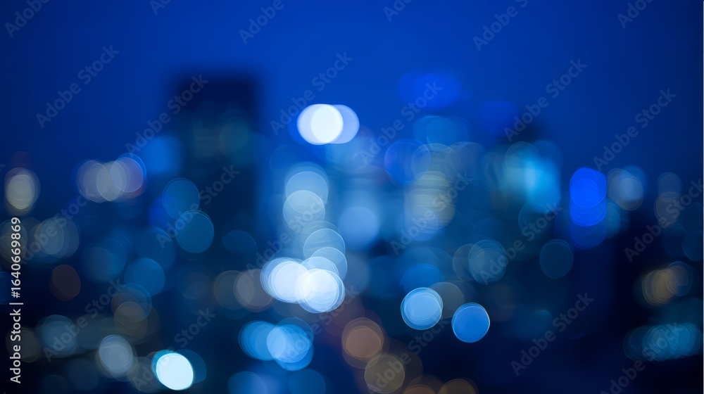 Fototapeta premium Abstract city light bokeh in deep blue tones, evoking the atmospheric glow of an urban nightscape. 