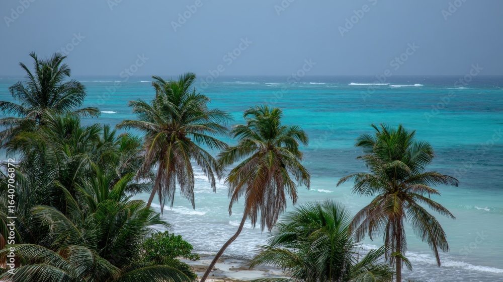 Obraz premium Idyllic Tropical Beach Scene with Azure Water, Palm Trees, and Serene Ocean View