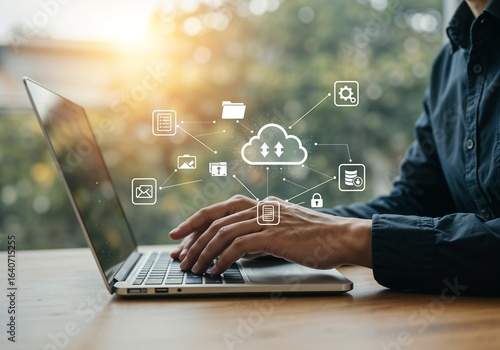 Person using laptop, cloud computing, data transfer, secure online storage, digital technology, modern workspace, professional business concept.