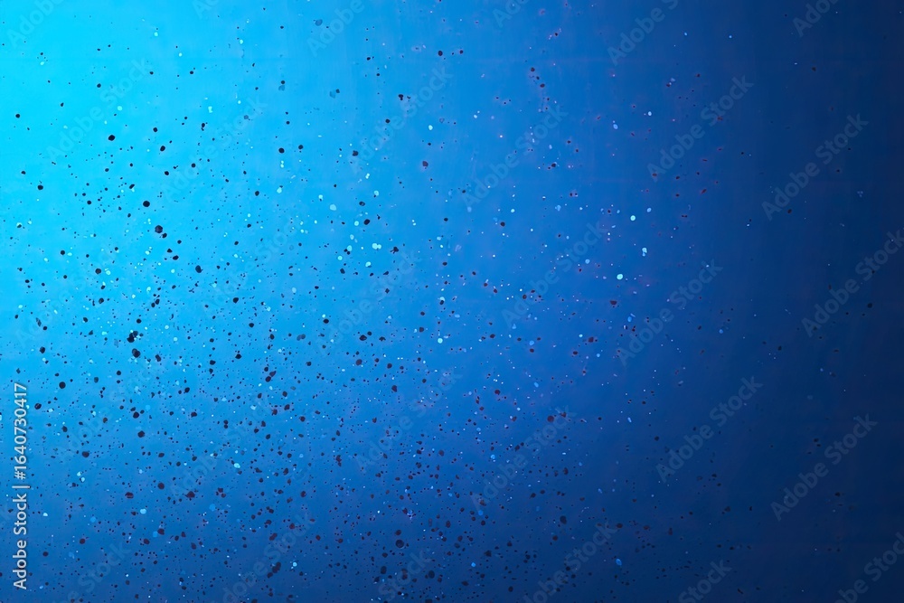 Fototapeta premium Abstract, vibrant, blue background with scattered, tiny, square confetti