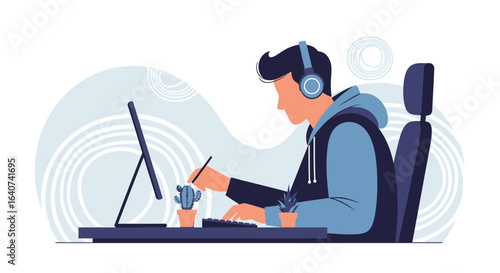 Creative Designer Working On Computer With Graphics Tablet And Headphones At Desk