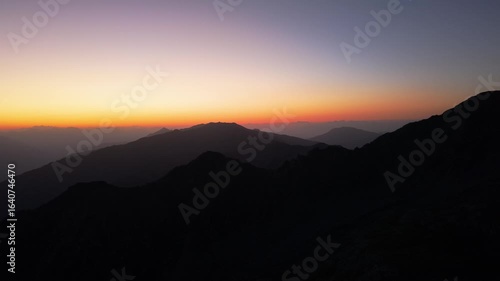 Wallpaper Mural Drone video of sunrise in the Italian Alps, showing mountain peaks, soft morning light, and peaceful alpine scenery. Torontodigital.ca
