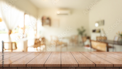 	
Empty wooden table top with lights bokeh on blur restaurant background.