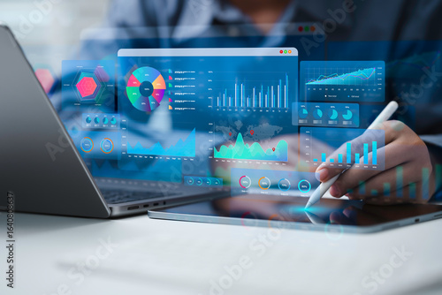 An Analyst uses a computer and dashboard for data business analysis and Data Management System with KPI to report. Database for technology finance, operations, sales, marketing and SEO