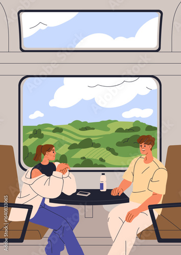 Train travel. Couple talking during railway journey. Young man and woman pass...