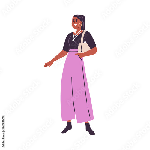 Happy young woman standing, smiling. Joyful female with bag and accessories, ...