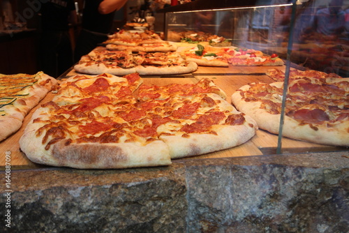Varieties of Italian pizzas displayed in a vitrine in Venice, Italy