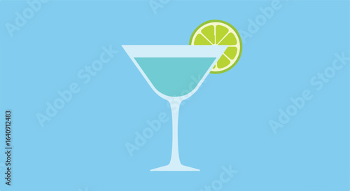 Teal drink in glass with a lime slice on light blue background. A refreshing beverage