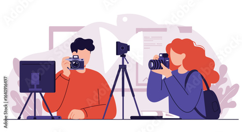 Two people taking photographs with studio setup with light, monitor, and soft backdrops