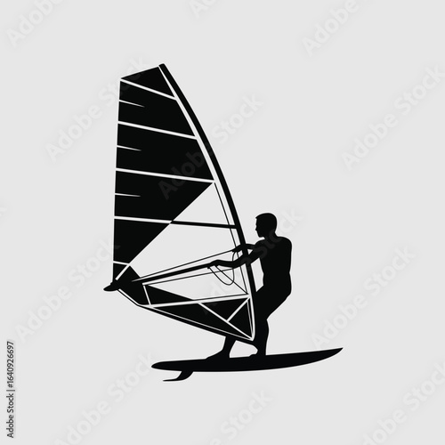 Dynamic silhouette of a determined windsurfer expertly navigating the waves, capturing the thrill of ocean sports and active adventure.