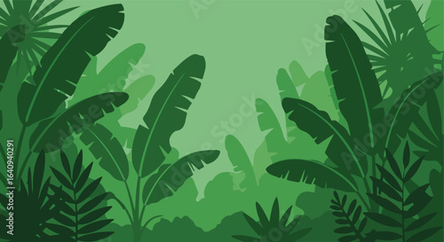 Lush, green rainforest canopy with tropical leaves in varying shades of green