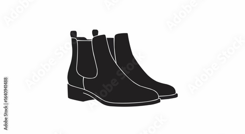 A pair of classic Chelsea boots in silhouette.