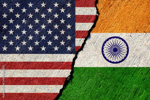 usa and india flags painted on cracked concrete wall