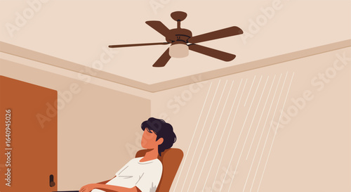 Indoor scene of person sitting beneath ceiling fan in muted colors, looking forward