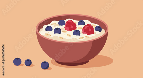 Breakfast bowl with oat, blueberries, and raspberries on a light orange backdrop