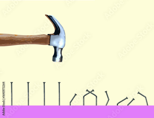 Hammer next to bent nails illustrating failure concept