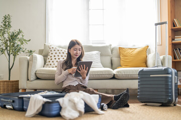 Portrait of woman use technology of tablet computer for hotel and resort booking online summer holiday travel system planning searching information weekend vacation trip.reservation online travel