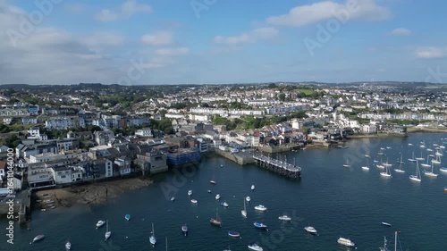 Falmouth, Cornwall, England: DRONE VIEWS: The town of Falmouth and the St Mawes ferry quay with moored yachts on the River Fal. Falmouth is a popular UK holiday destination and port town (Clip 2).
