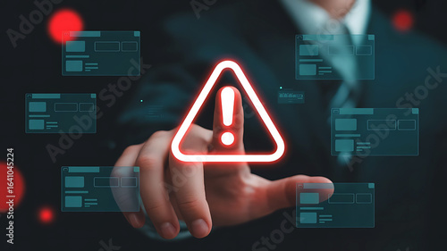 Wallpaper Mural Businessman s finger points to a glowing red warning sign with an exclamation mark on a digital interface Torontodigital.ca