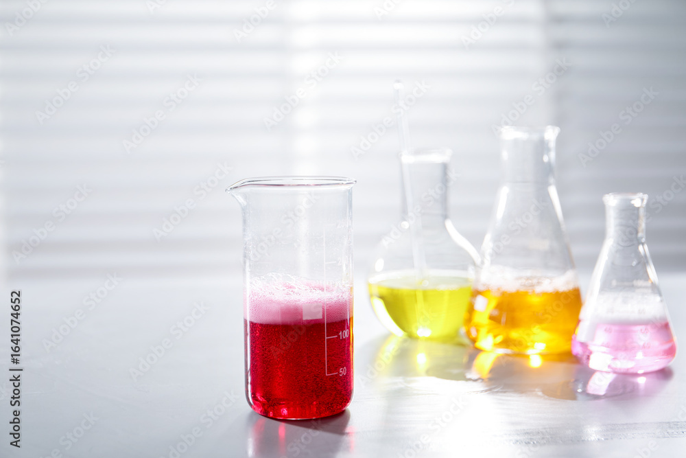 Laboratory glassware with different samples on light table indoors. Solution chemistry Laboratory glassware with different samples on light table indoors. Solution chemistry