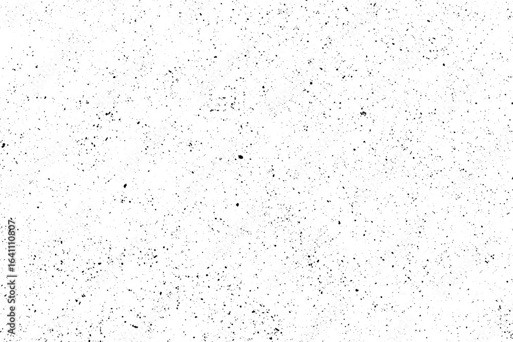 Obraz premium Abstract black speckled texture on a white background.