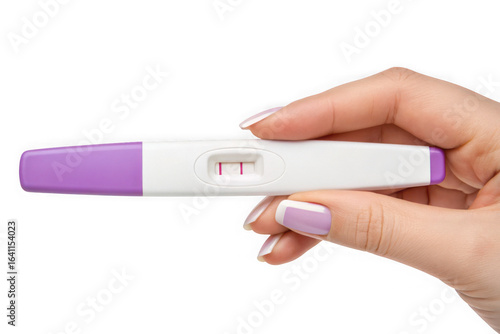 Hand holding positive pregnancy test showing two lines