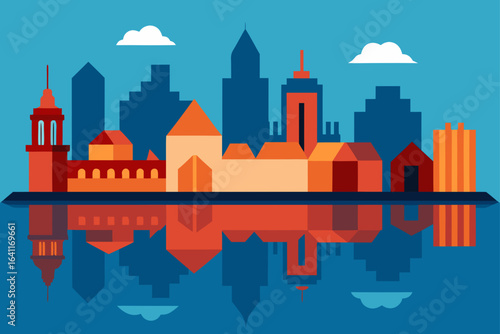 Flat cityscape reflected in water with clouds in the sky