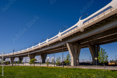 A bridge with concrete pillars across the sea bay.