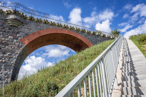 Fototapeta Naklejka Na Ścianę i Meble -  Antique railroad bridge in Glaznoty, small village in Masuria region of Poland