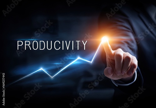 Business person's hand touches a rising productivity graph