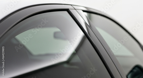 Closeup of car window tint installation service for automotive glass protection and privacy solutions near me