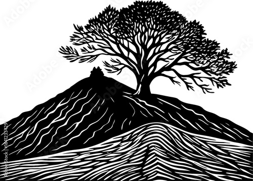 Hill with lone tree silhouette