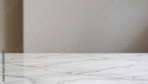 Minimalist marble tabletop with subtle veining, showcasing elegance and simplicity in a soft-focused setting.