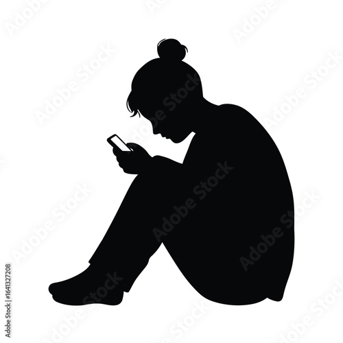 Silhouette of a person sitting and using a mobile phone, isolated on white background