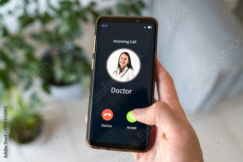 фотографія Accepting incoming call from the doctor. Concept of health issue.
