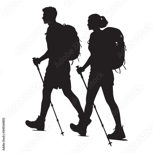 Silhouette of Hiking Couple with Backpacks and Trekking Poles