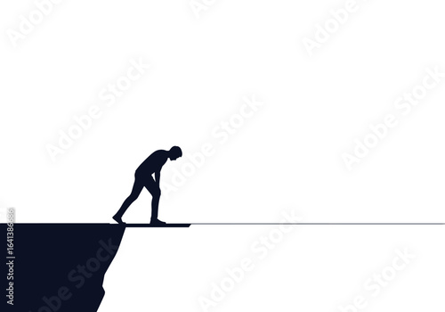 Silhouette figure poised at the edge of a cliff taking a step forward into the unknown abyss