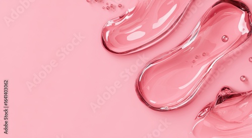 Abstract liquid drops on pink background