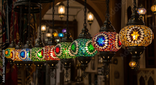 Colorful mosaic glass lanterns illuminate a dimly lit marketplace