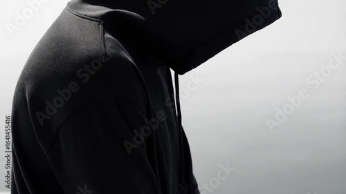 Anonymous Figure in Black Hoodie, Mysterious and Brooding