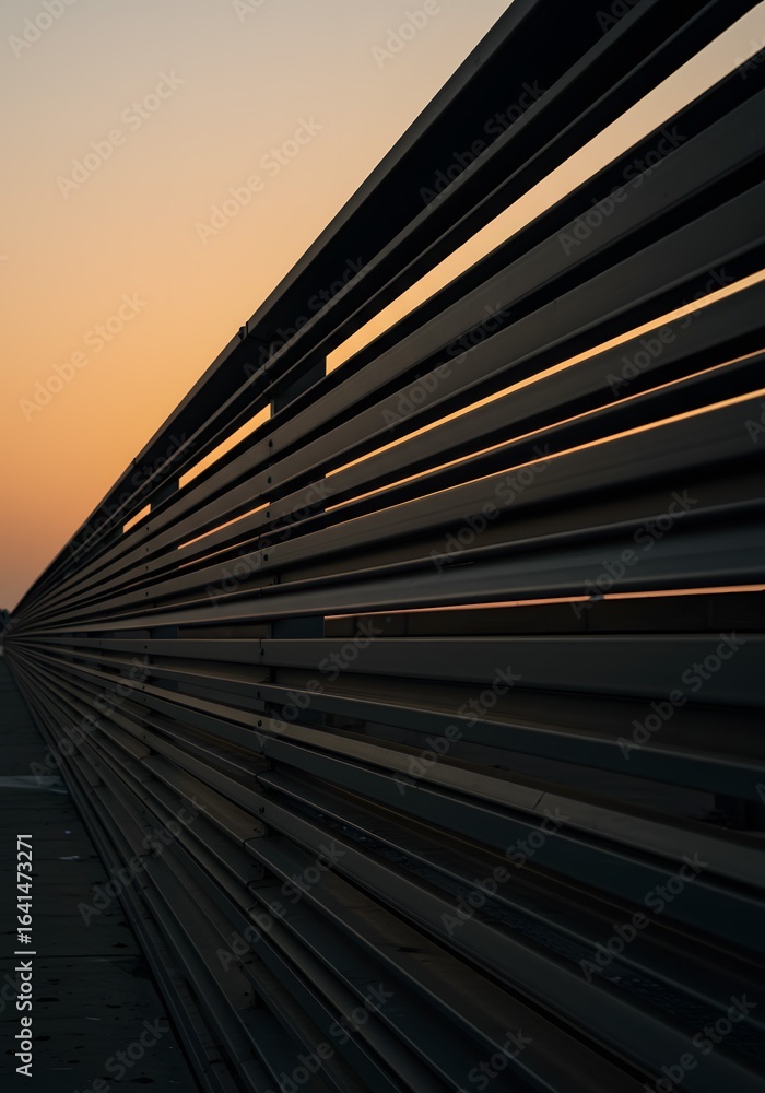 Naklejka premium Abstract Metal Slat Structure at Sunset A Modern Geometric Perspective