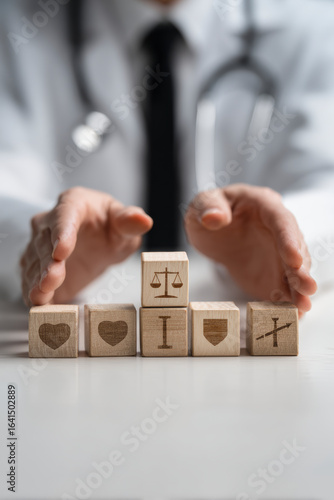 Doctor's Symbolism: Wooden blocks show medical values - healthcare, justice, protection, and wellness